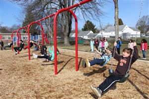 Students on new swing set