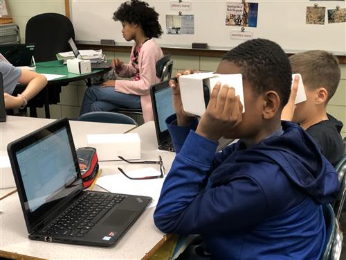 boy using VR headset 