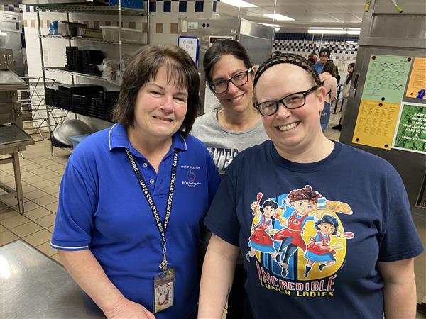 Three GCHS school nutrition employees smile at the camera